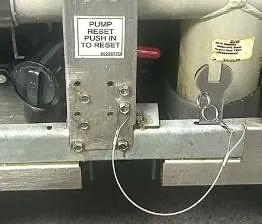 Wrench and reset rod assembly