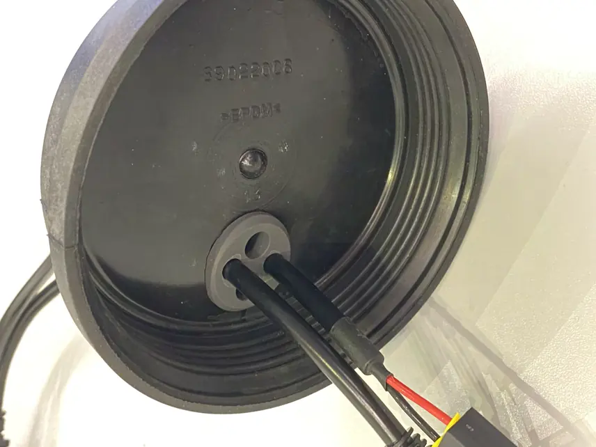 Installing the CANbus cable grommet into the soft cover.