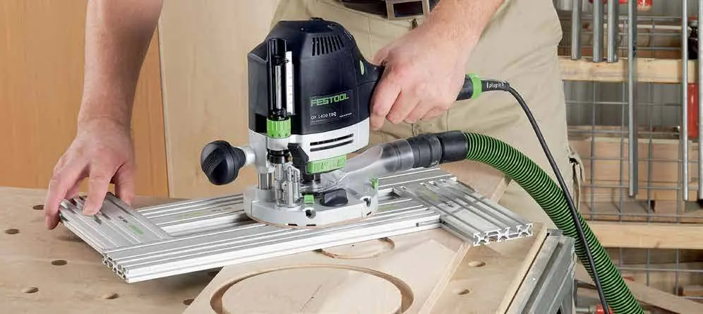 Using a plunge router with a guide rail.