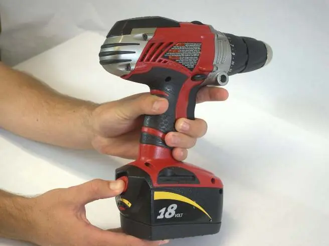 Locating the red battery locking switch