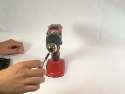 Removing the reverse-threaded screw