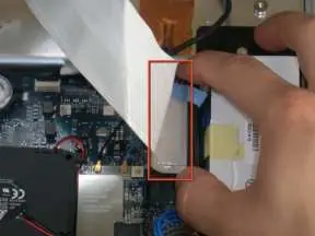 Disconnecting the hard drive data cable.