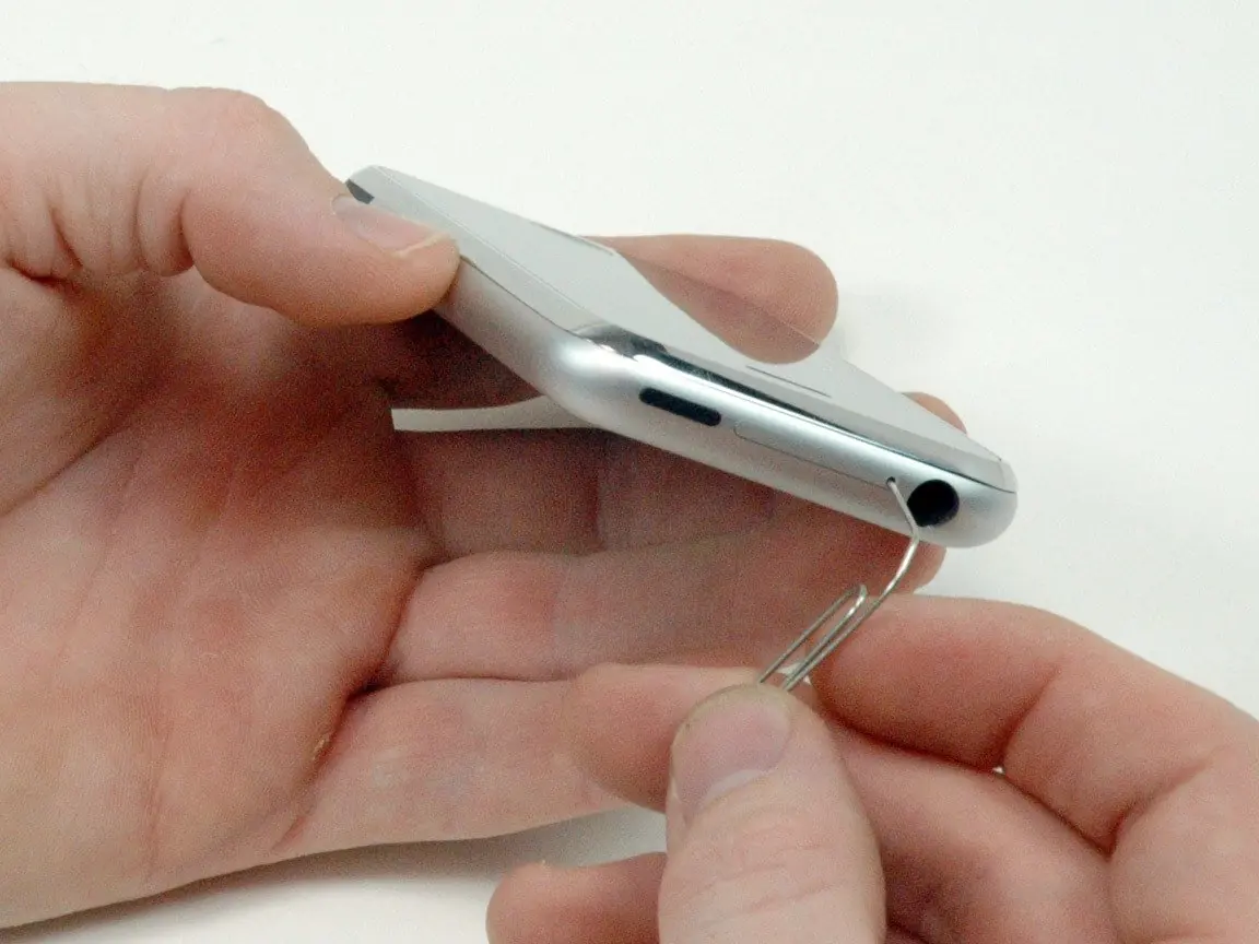 Inserting the SIM card eject tool