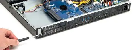 Installing a PCIe card into the chassis.