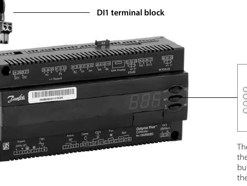 Optyma Plus control unit interface and DI1 terminal block location.