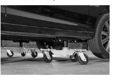 Placement of the dolly under the vehicle.