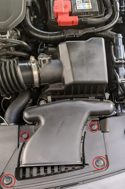 Removing plastic clips from the intake duct