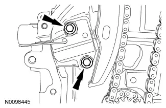 Removing the timing chain tensioner bolts.