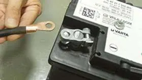 Preparing the battery terminal for installation.
