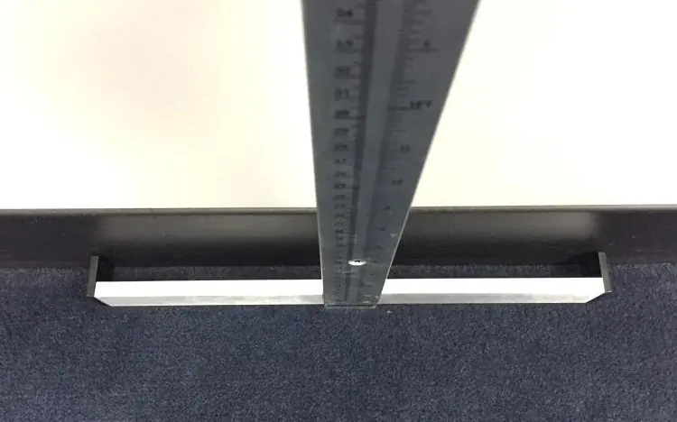 Attaching the footpiece to the height rod.