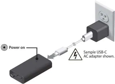 Connecting the charger to the USB-C power source.