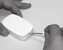 Opening the transmitter housing with a screwdriver