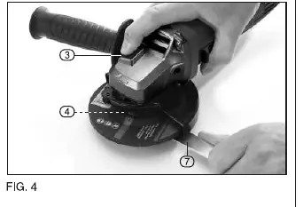 Using the spindle lock and spanner