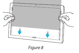 Sliding the privacy filter into the mounting tabs.