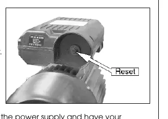 Thermal overload reset button location