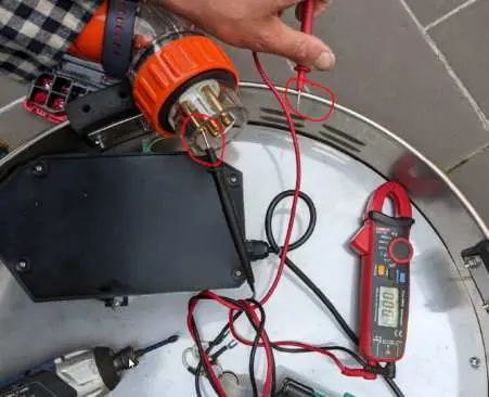 Using a multimeter to check continuity.