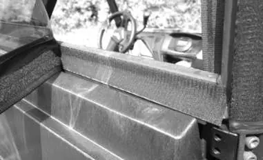 Placement of the 53-inch adhesive Velcro strip on the lower frame.