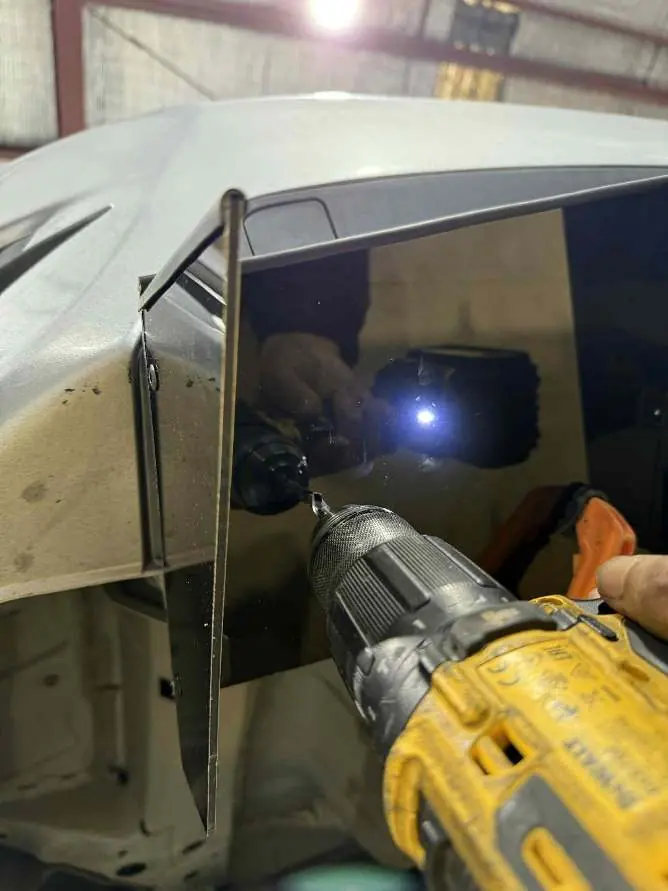 Drilling holes into the rear bumper