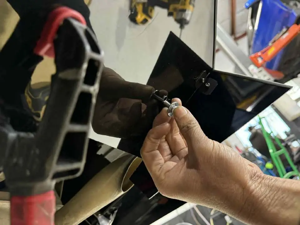 Inserting bolts and washers