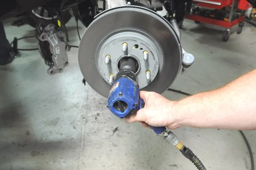 Removing the CV axle nut.