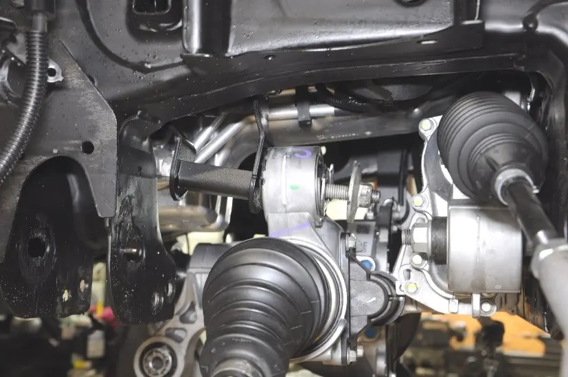 Trimming the driver-side rear crossmember mount.