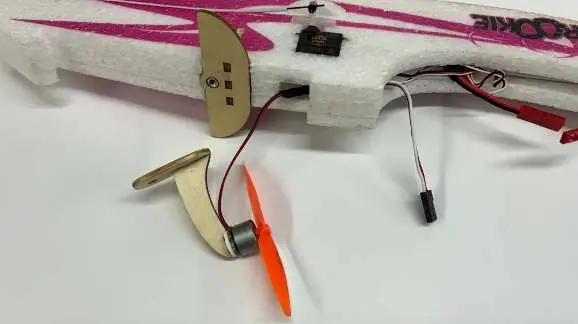 Connect the motor wiring to the fuselage and prepare the motor mount for installation.