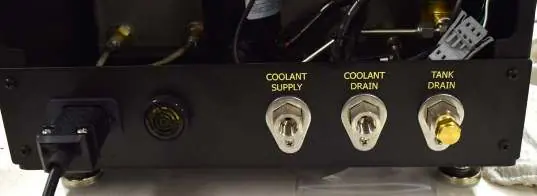 Rear panel connections for coolant and drain lines