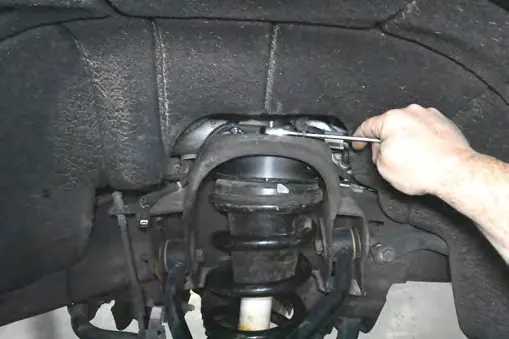 Installing studs into the upper strut spacer