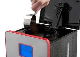 Adding coffee grounds