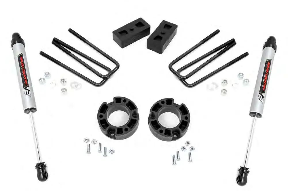 Kit components including strut spacers, rear blocks, u-bolts, and rear shocks.