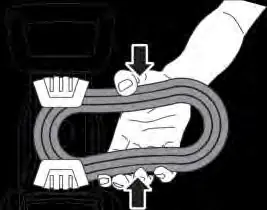 Storing the hose in the hose holder.