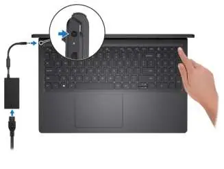 Connecting the power adapter and turning on the laptop.