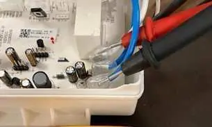 Voltage check at compressor board