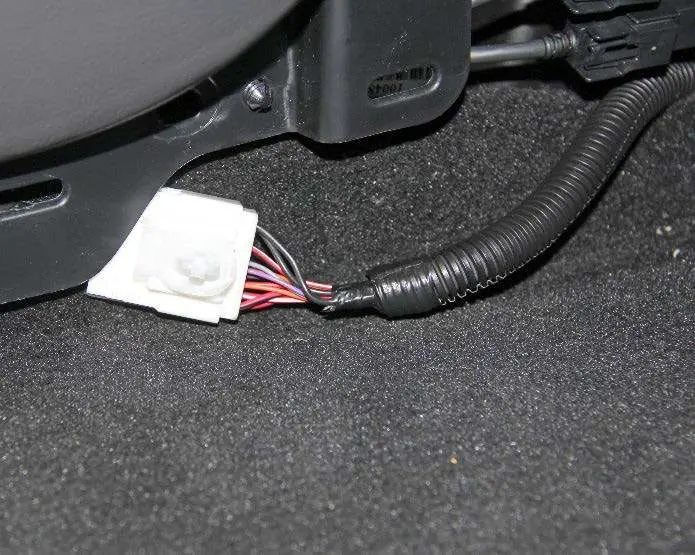 Releasing the harness connector