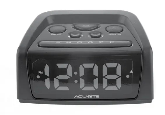 Front view of the alarm clock showing control buttons and display.