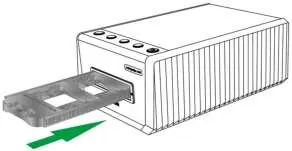 Inserting the film holder into the scanner.