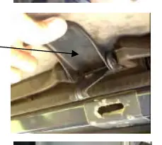 Releasing the header latch from the windshield frame.