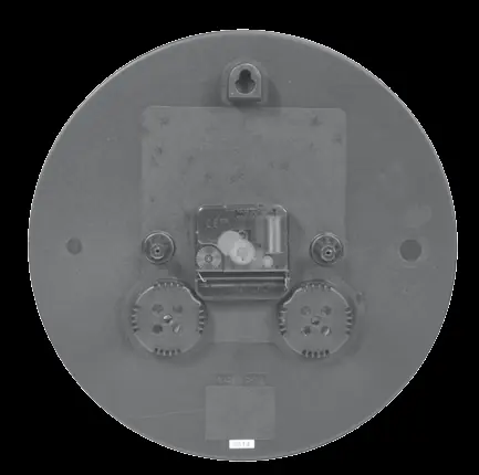 Back view of the clock showing the weather-resistant cover and battery compartment.