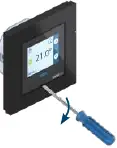 Removing the front display using a narrow tool.