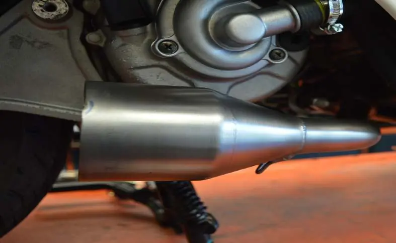 Position the exhaust pipe section.