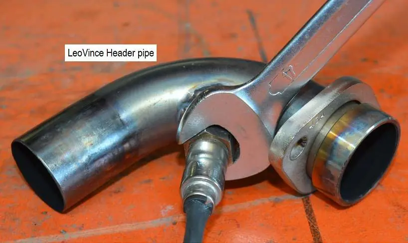 Install the oxygen sensor into the header pipe.