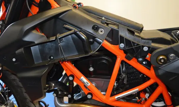 Remove the side fairing panel.