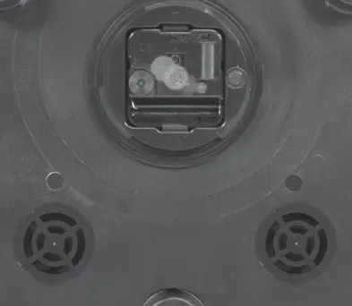 Close-up of the clock mechanism and adjustment knobs