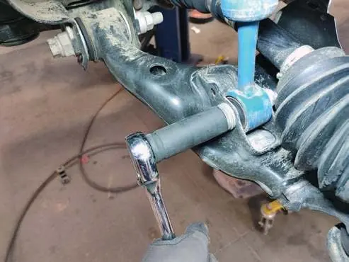 Removing top mount nuts