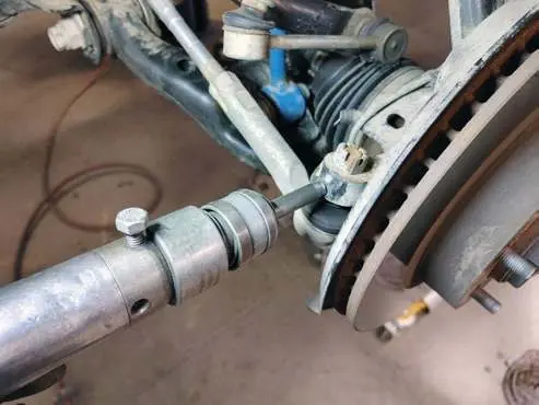Separate the tie rod end.