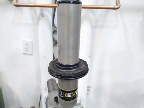 Install the new coilover components.