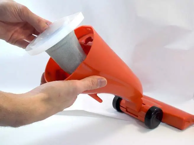 Removing the dust cup from the cavity.